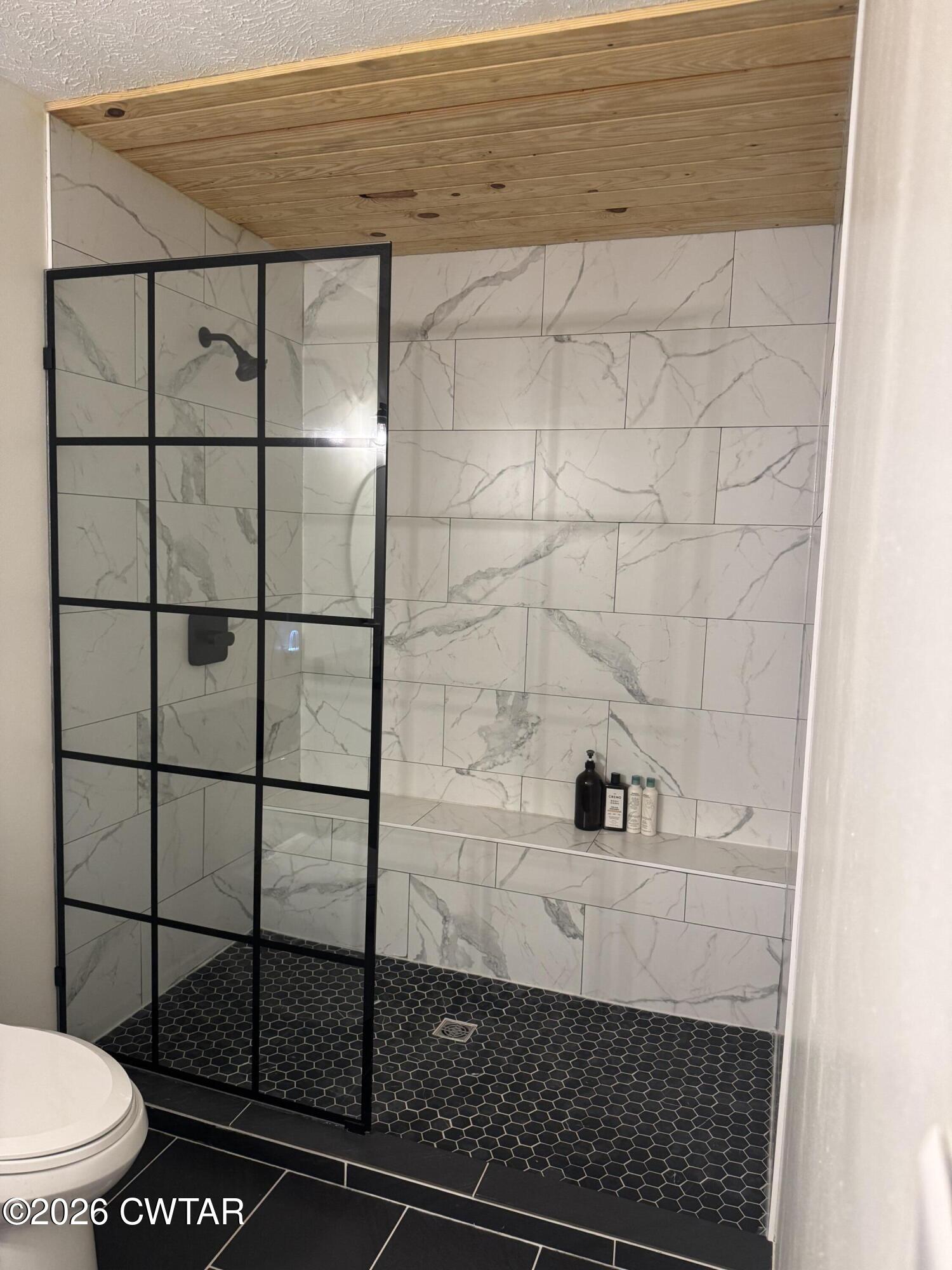 815 Trice Road Henderson, TN 38340 - Photo 23 of 34 a bathroom with a toilet and a shower