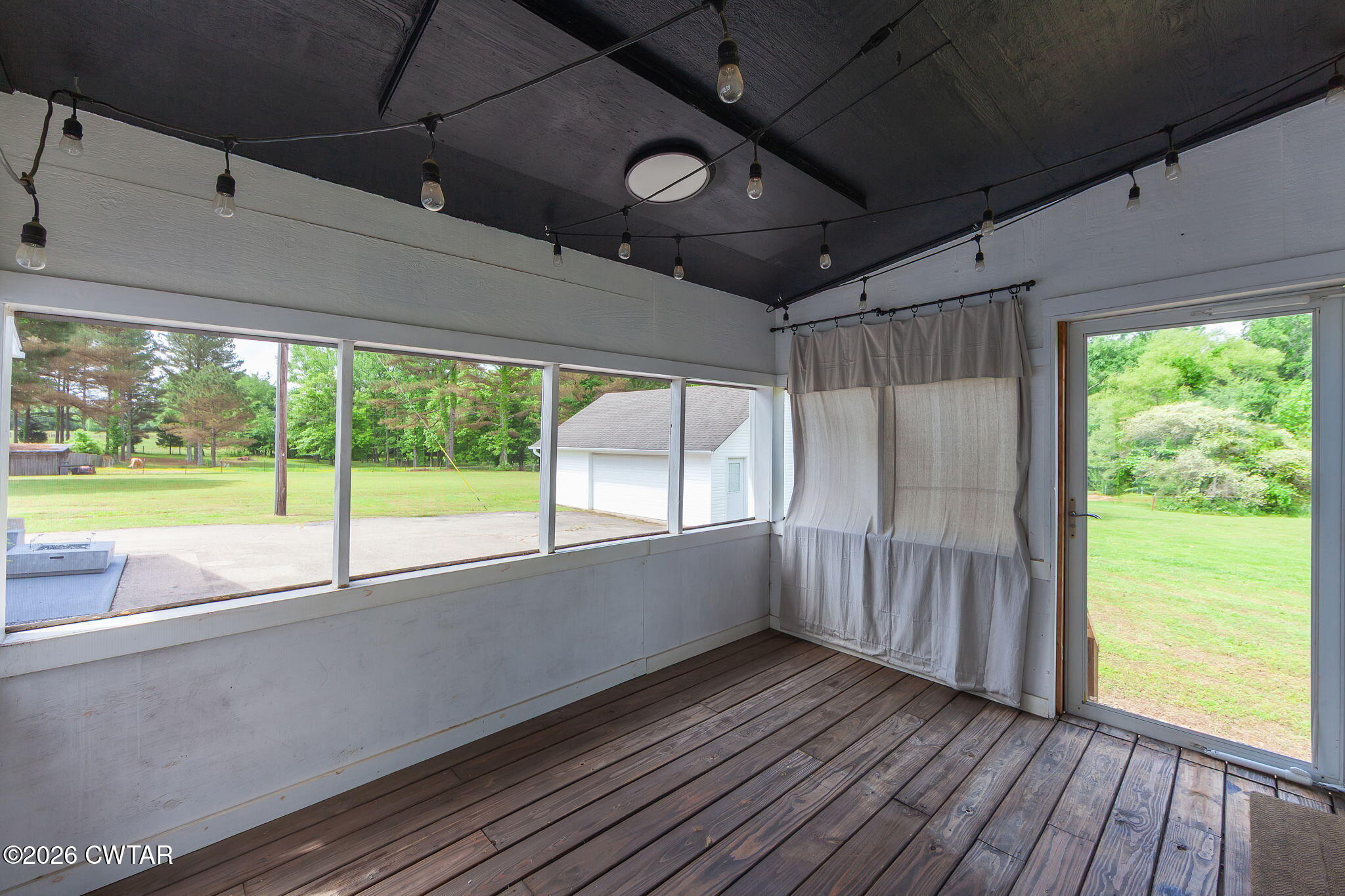 815 Trice Road Henderson, TN 38340 - Photo 28 of 34 a view of an empty room with wooden floor and a window