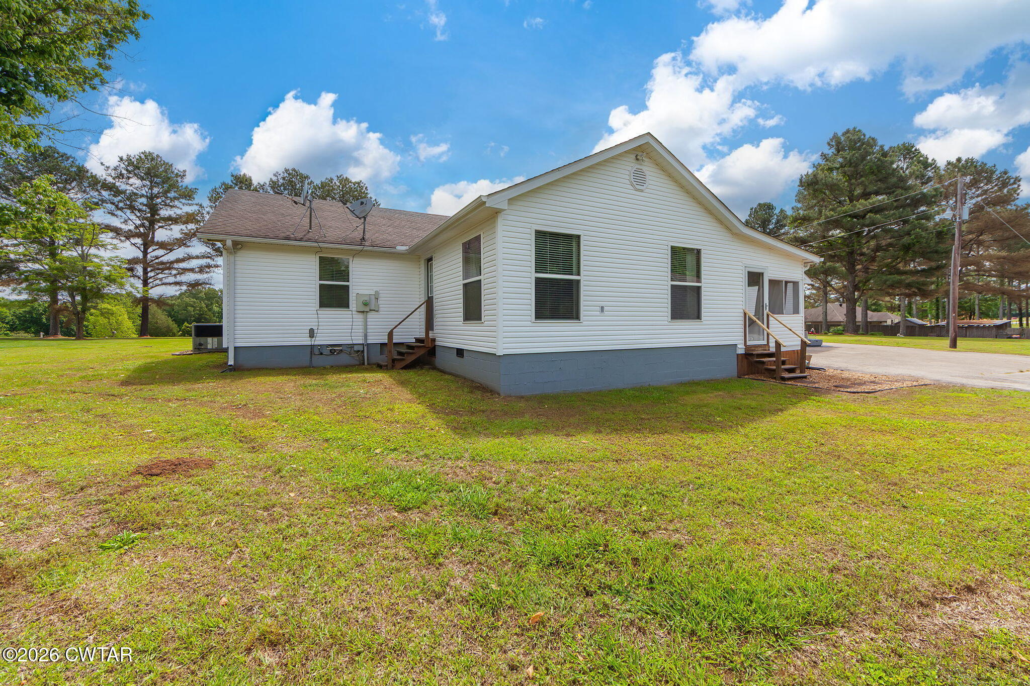 815 Trice Road Henderson, TN 38340 - Photo 29 of 34 a view of a house with a yard