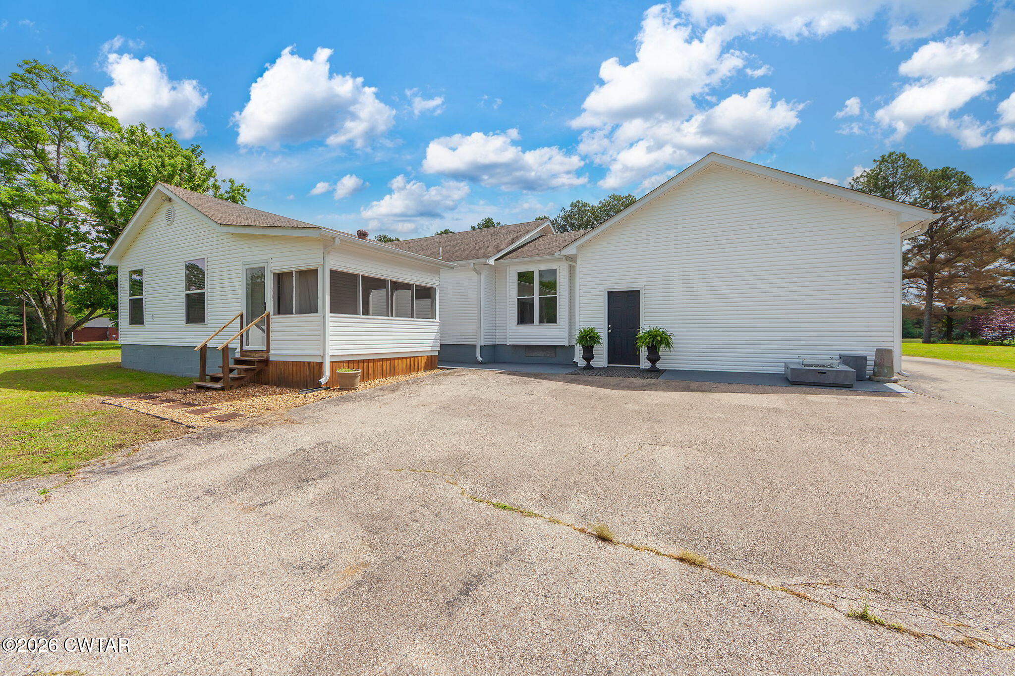 815 Trice Road Henderson, TN 38340 - Photo 31 of 34 a view of a house with backyard and trees