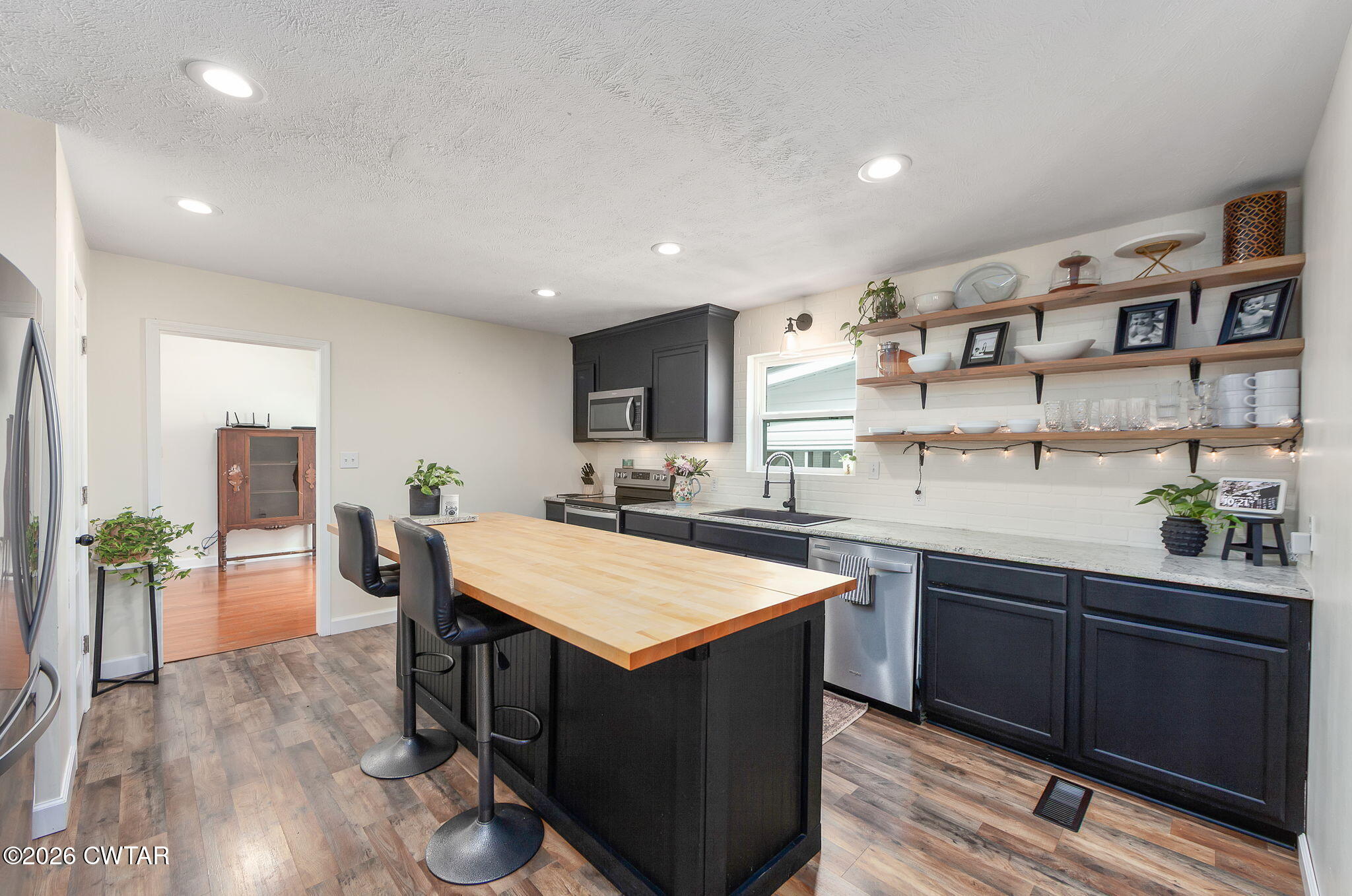 815 Trice Road Henderson, TN 38340 - Photo 5 of 34 a large kitchen with lots of counter space and wooden floor