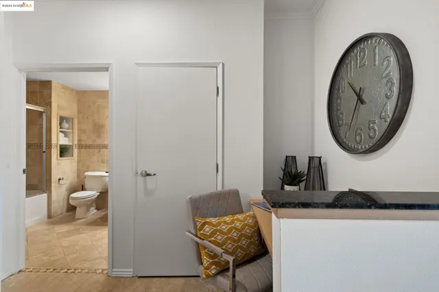 a bathroom with a toilet and a mirror