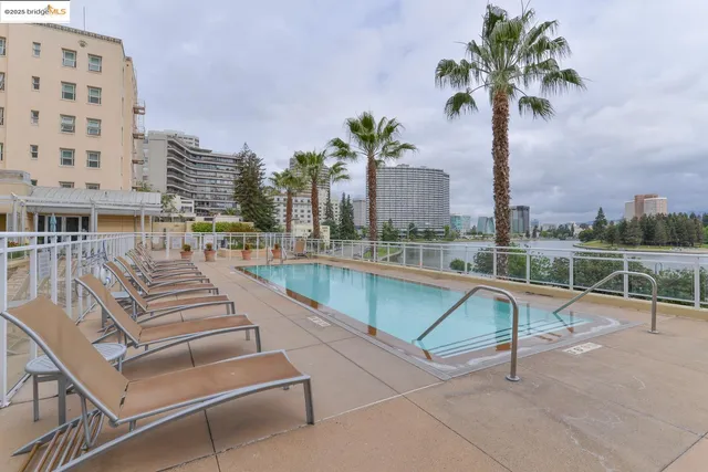 a view of a swimming pool with a lounge chairs