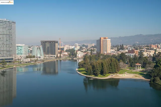 a view of swimming pool with outdoor seating and plants