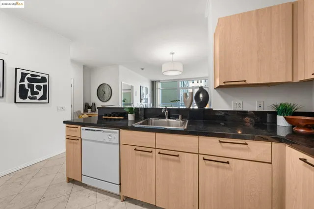 a kitchen with sink and cabinets