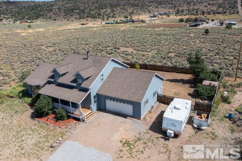 2920 Bullfrog Road Reno, NV 89521 - Photo 1 of 40 an aerial view of a house with a yard and lake view