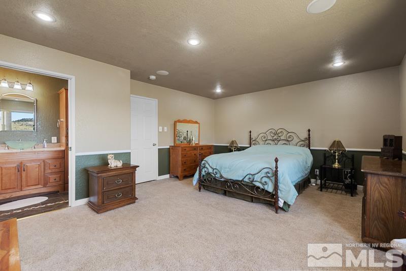 2920 Bullfrog Road Reno, NV 89521 - Photo 19 of 40 a bedroom with a bed and furniture