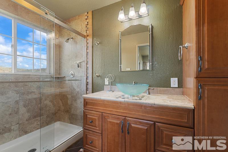 2920 Bullfrog Road Reno, NV 89521 - Photo 20 of 40 a bathroom with a sink and a mirror