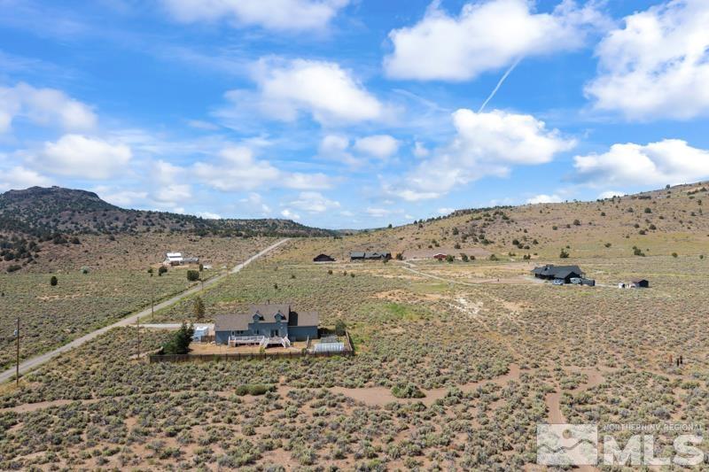 2920 Bullfrog Road Reno, NV 89521 - Photo 36 of 40 a view of a dry yard with mountains in the background
