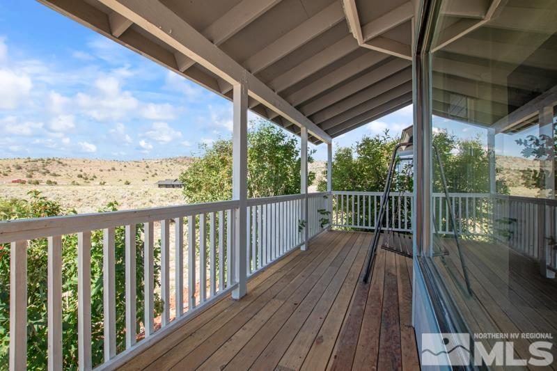 2920 Bullfrog Road Reno, NV 89521 - Photo 6 of 40 a view of a balcony with wooden floor