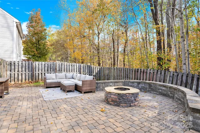 a patio with patio couch and chairs