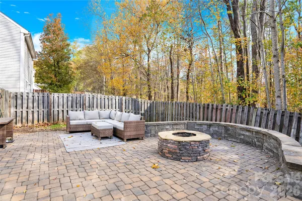 a patio with patio couch and chairs