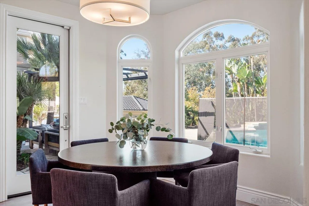 16270 Windpiper Road Poway, CA 92064 - Photo 13 of 65 a view of a dining room with furniture a chandelier and wooden floor