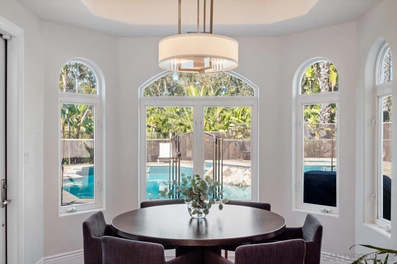 16270 Windpiper Road Poway, CA 92064 - Photo 14 of 65 a view of a dining room with furniture and chandelier