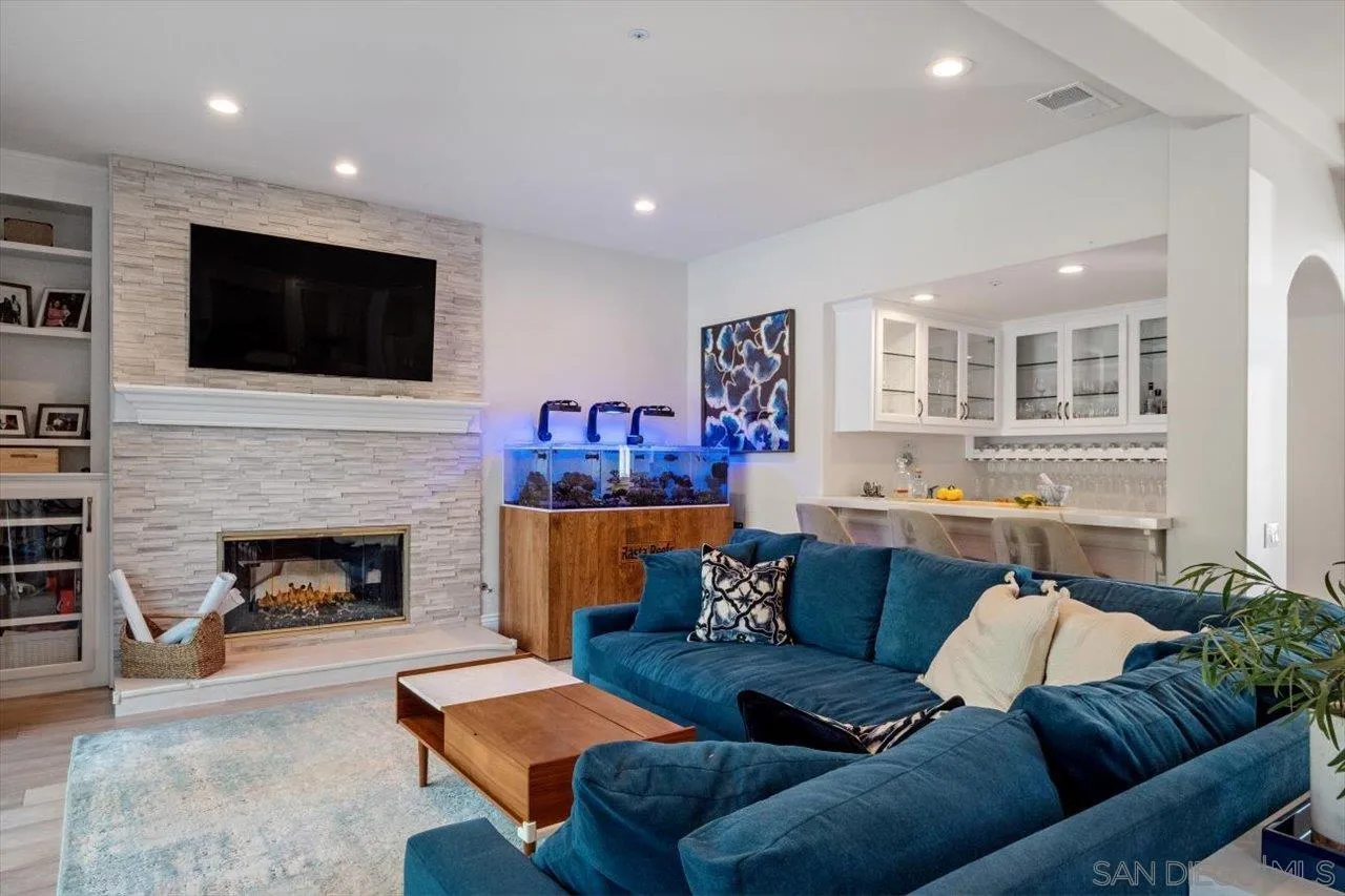 16270 Windpiper Road Poway, CA 92064 - Photo 15 of 65 a living room with furniture and a fireplace