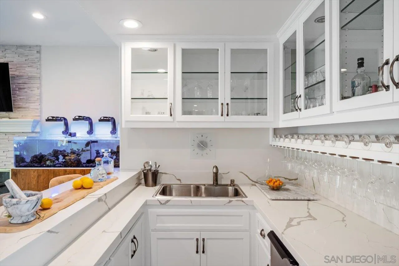 16270 Windpiper Road Poway, CA 92064 - Photo 18 of 65 a kitchen with a sink a stove and cabinets