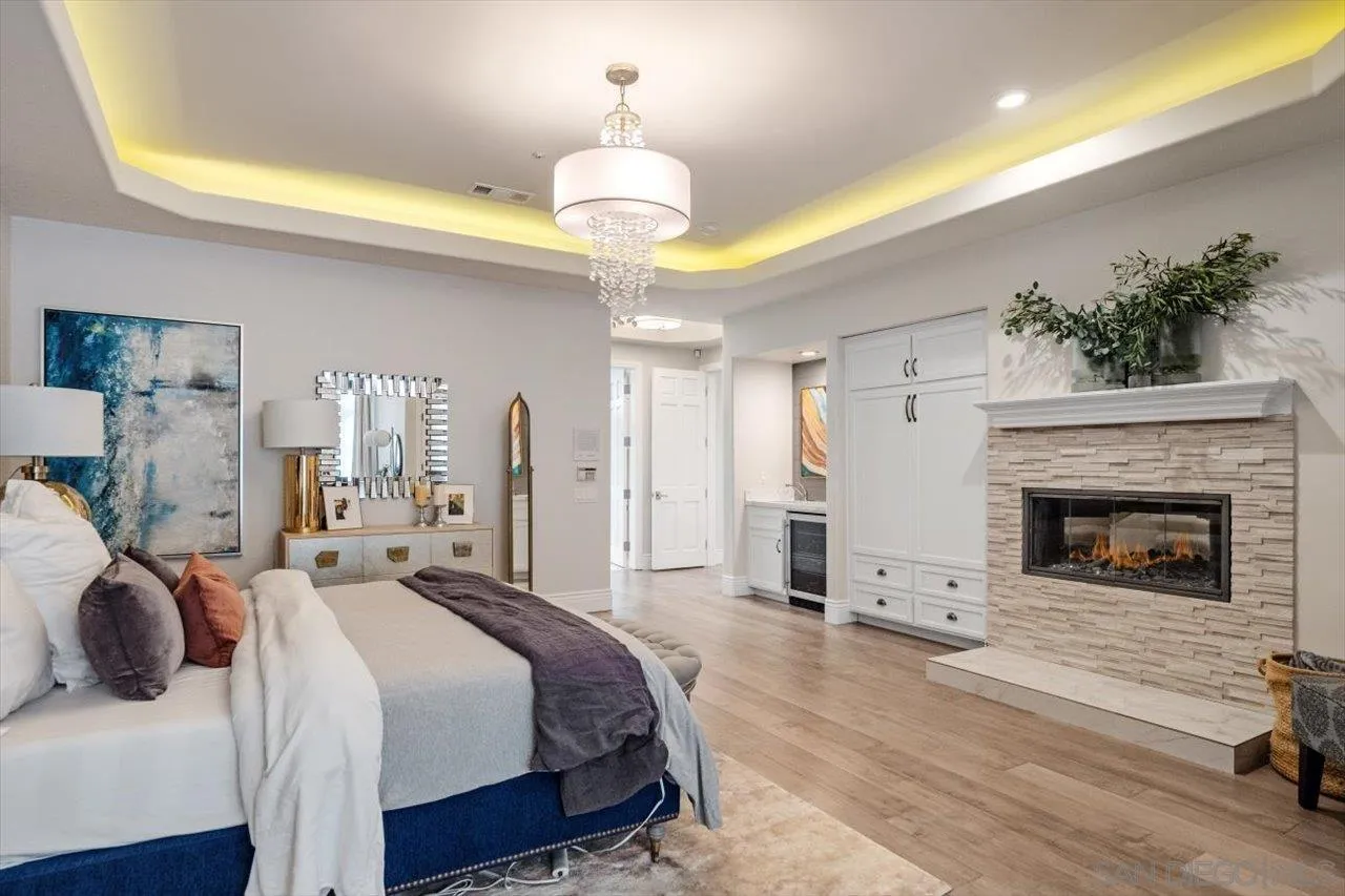 16270 Windpiper Road Poway, CA 92064 - Photo 21 of 65 a bedroom with a bed and a fireplace