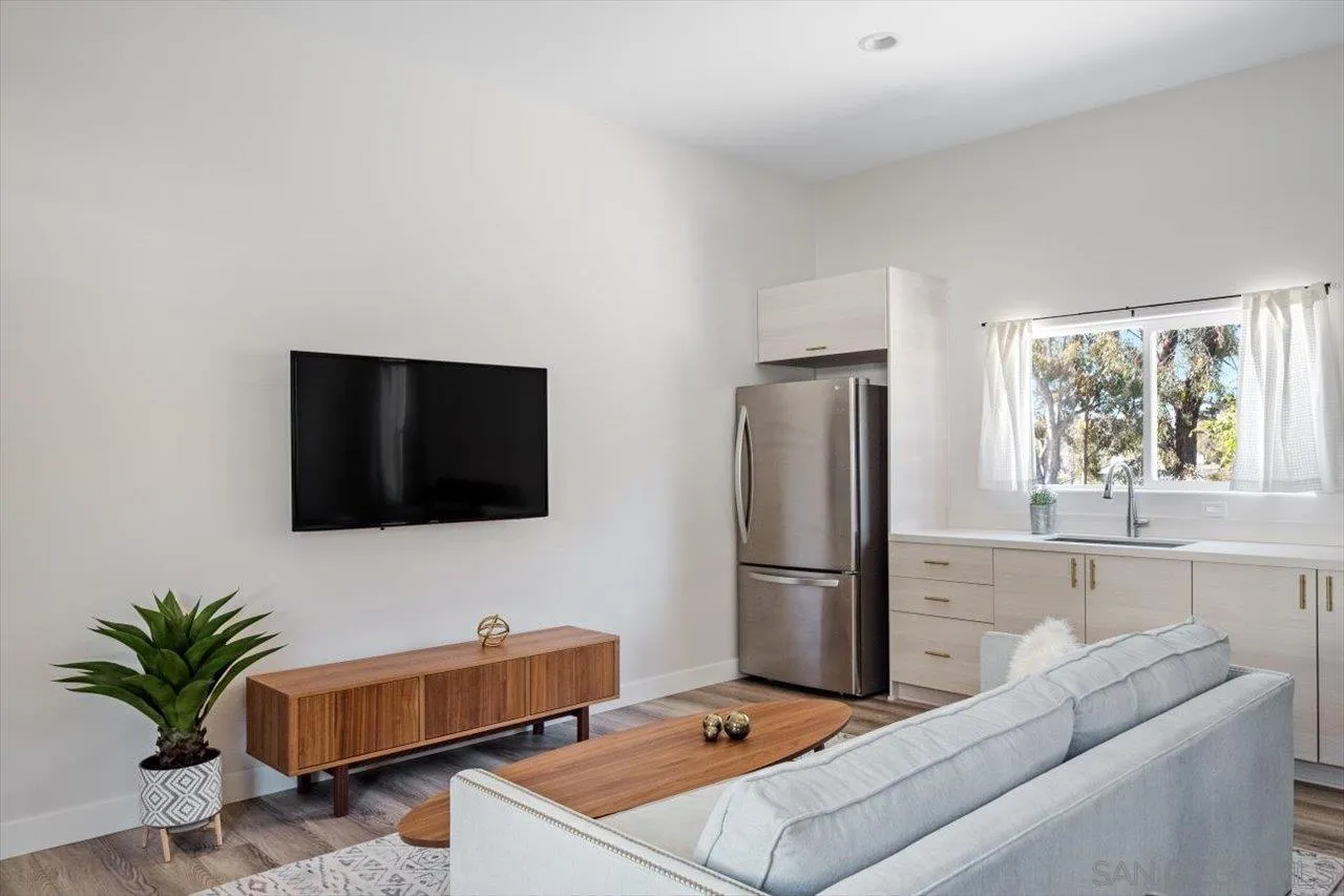 16270 Windpiper Road Poway, CA 92064 - Photo 39 of 65 a living room with furniture and a flat screen tv