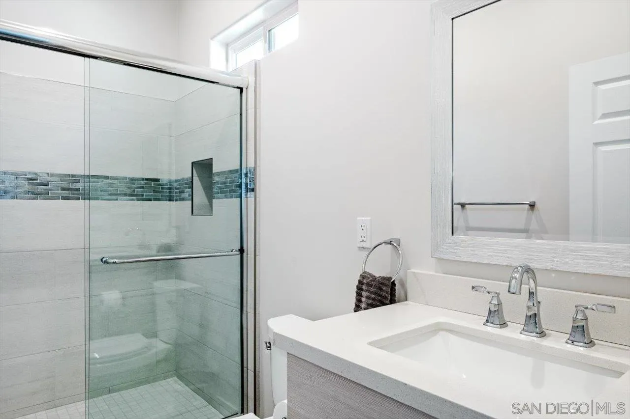 16270 Windpiper Road Poway, CA 92064 - Photo 40 of 65 a bathroom with a sink and shower