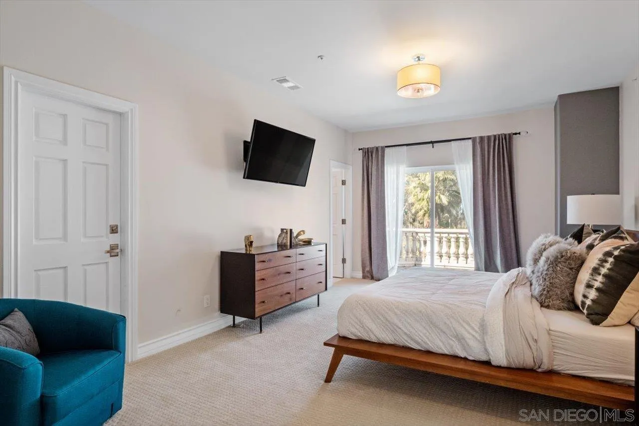 16270 Windpiper Road Poway, CA 92064 - Photo 51 of 65 a bedroom with a bed and a television
