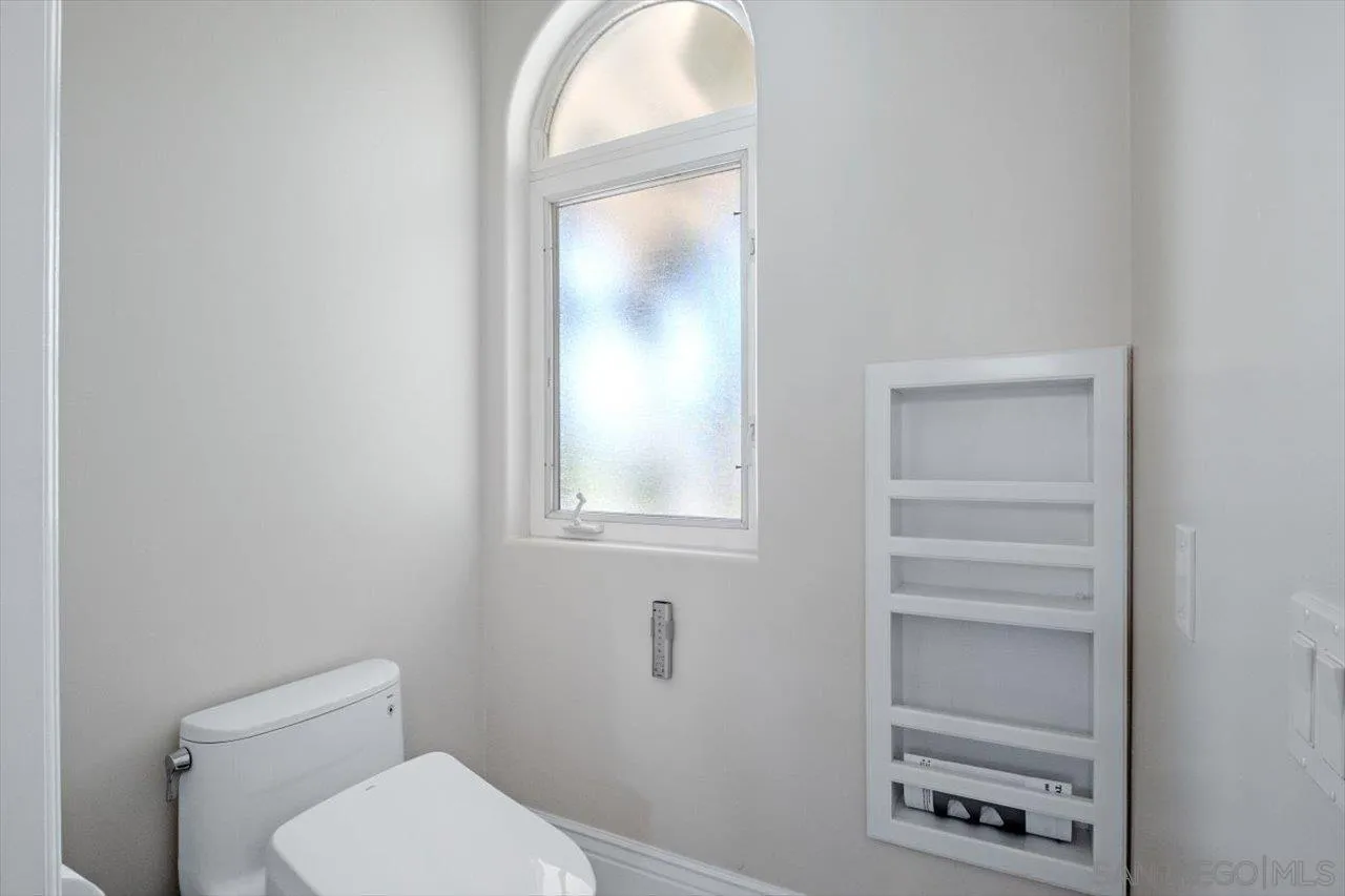 16270 Windpiper Road Poway, CA 92064 - Photo 56 of 65 a white toilet sitting next to a window