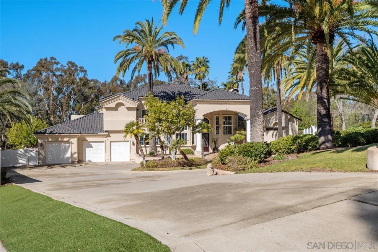 16270 Windpiper Road Poway, CA 92064 - Photo 59 of 65 a front view of a house with a yard and garage
