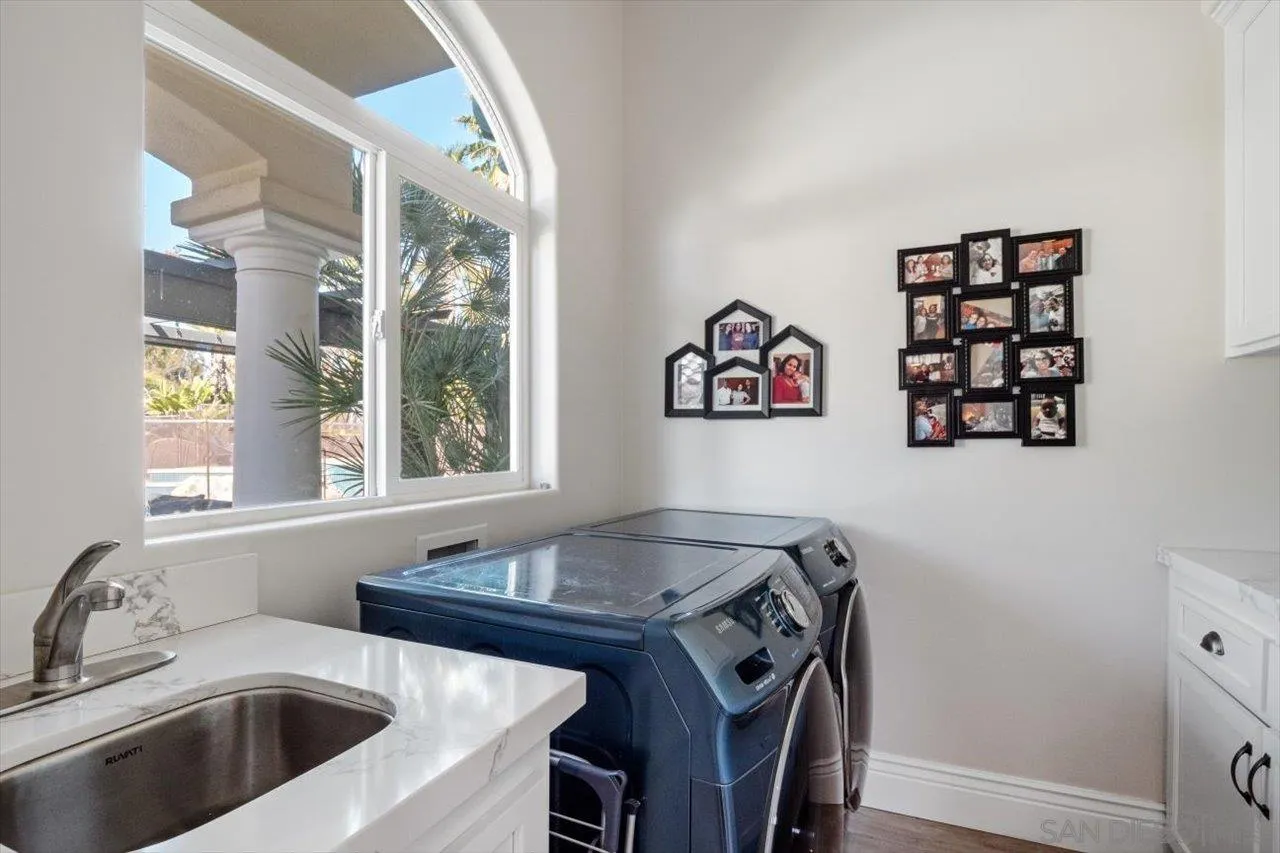 16270 Windpiper Road Poway, CA 92064 - Photo 61 of 65 a kitchen with a sink a stove and a window