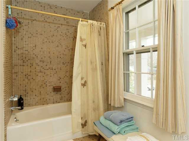 4413 Pitt Street Raleigh, NC 27609 - Photo 20 of 25 a bathroom with a tub and a shower