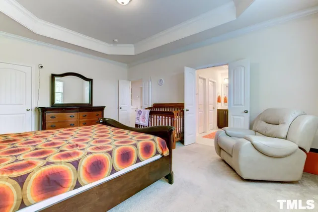 a bedroom with a bed and couch