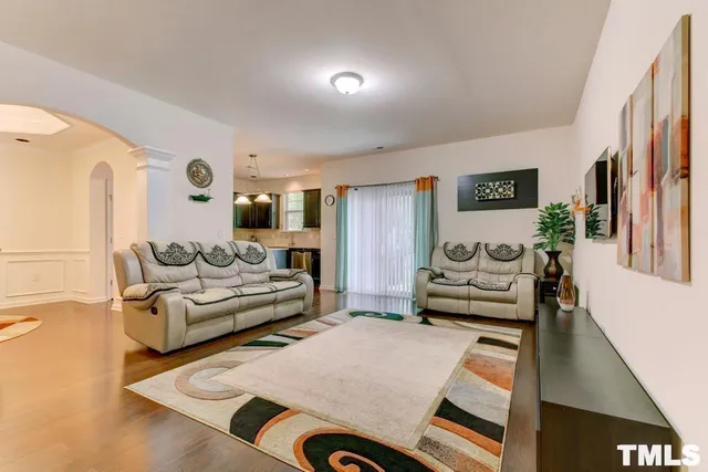 a living room with furniture and a table