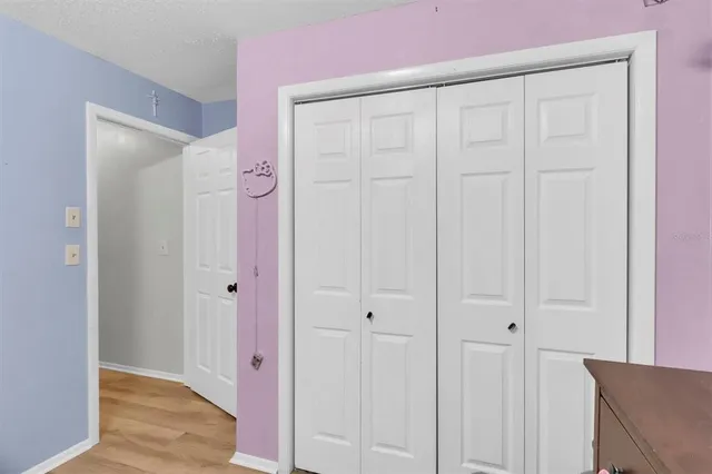 wooden floor with white walls