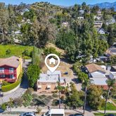 an aerial view of a house with a outdoor space