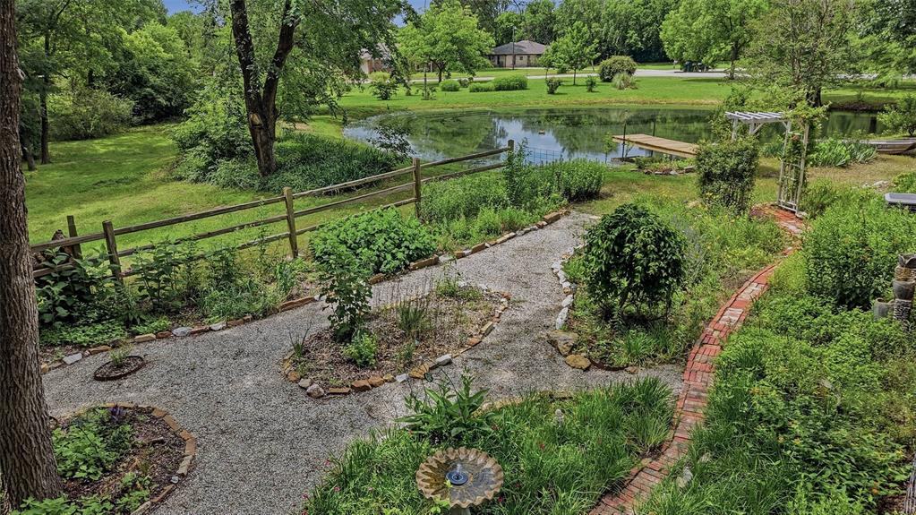 522 High Country Road Sherman, TX 75092 - Photo 33 of 38 a view of a garden with a lake view