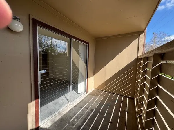 a view of a house with a door and wooden floor