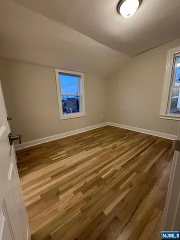a large kitchen with kitchen island a sink stainless steel appliances and cabinets