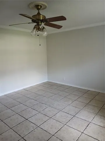 a view of a room and chandelier fan