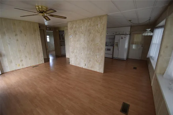 a kitchen with stainless steel appliances a stove refrigerator sink and cabinets
