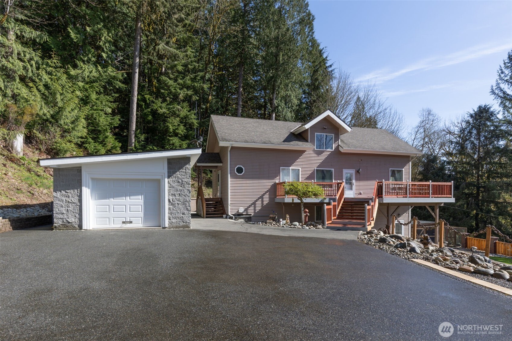 a view of a house with patio and a garden