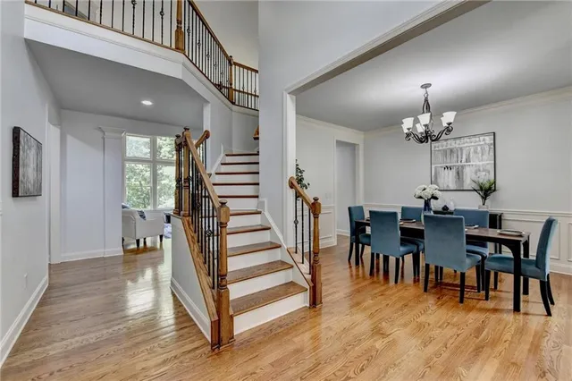 a view of a dining room with furniture and wooden floor