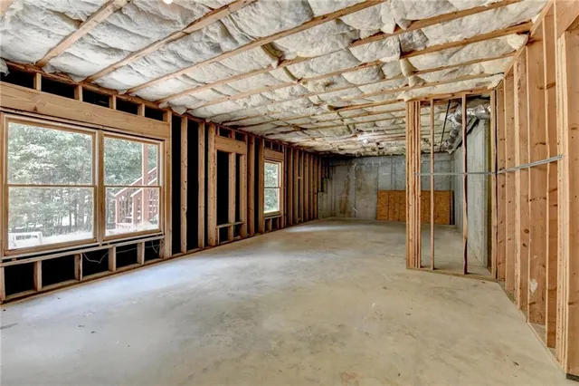 a view of empty room with wooden walls