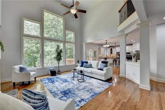 a living room with furniture and a large window