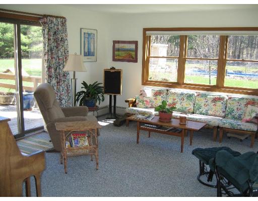 466 Warren Wright Road Belchertown, MA 01007 - Photo 3 of 10 a living room with furniture and a window