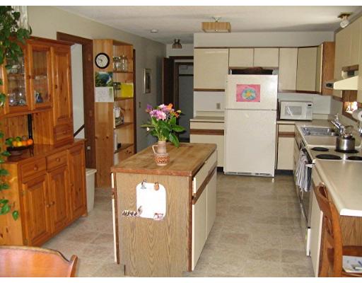 466 Warren Wright Road Belchertown, MA 01007 - Photo 4 of 10 a kitchen with stainless steel appliances granite countertop a refrigerator and a stove