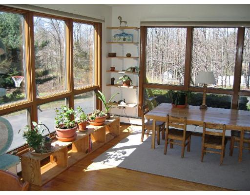 466 Warren Wright Road Belchertown, MA 01007 - Photo 5 of 10 a living room with furniture and a large window