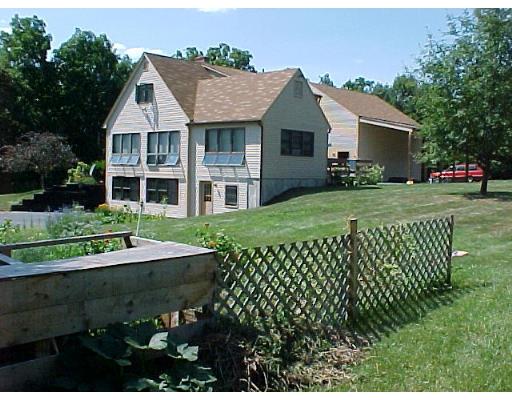 466 Warren Wright Road Belchertown, MA 01007 - Photo 8 of 10 a front view of a house with a yard