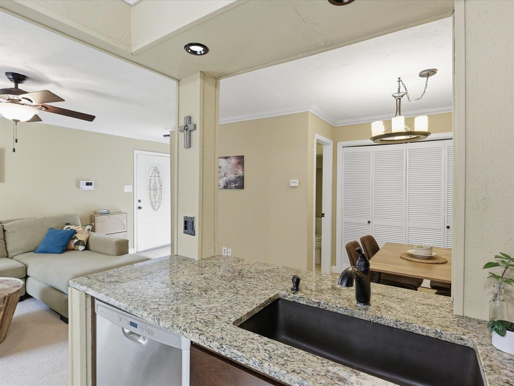 4250 Madera Road Irving, TX 75038 - Photo 11 of 31 a bathroom with a granite countertop sink and a mirror
