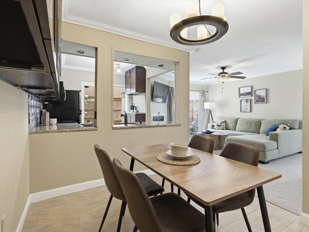 4250 Madera Road Irving, TX 75038 - Photo 14 of 31 a view of a dining room with furniture and wooden floor