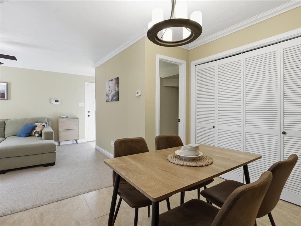 4250 Madera Road Irving, TX 75038 - Photo 15 of 31 a view of a dining room with furniture and wooden floor