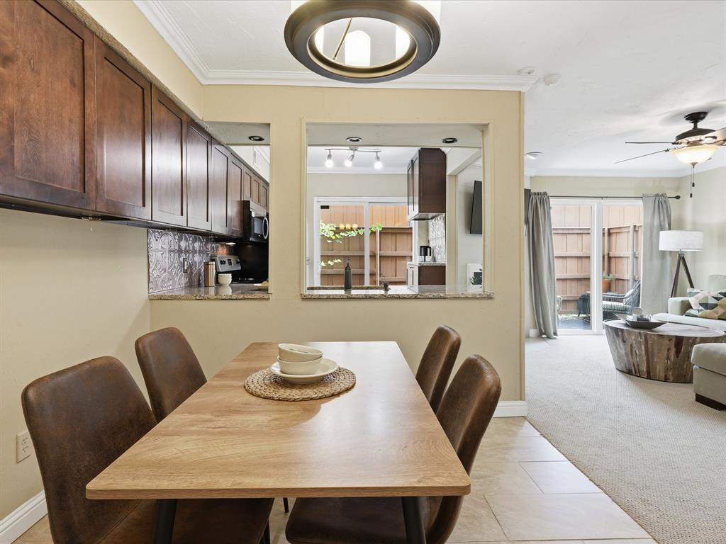 4250 Madera Road Irving, TX 75038 - Photo 16 of 31 a view of a dining room with furniture a couch and wooden floor
