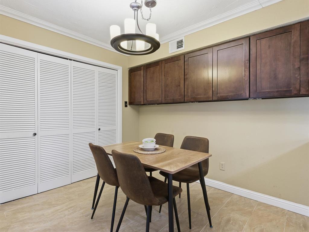 4250 Madera Road Irving, TX 75038 - Photo 17 of 31 a view of a dining room with furniture and chandelier